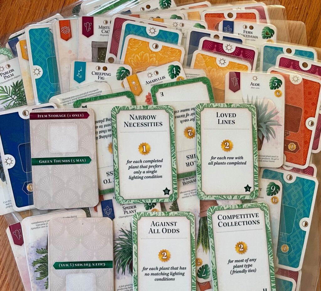 The stacks of laminated sheets containing all the Verdant PNP cards